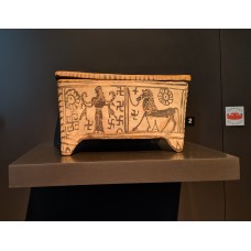 Boeotian ceramic box with lion, goddess, and swastikas